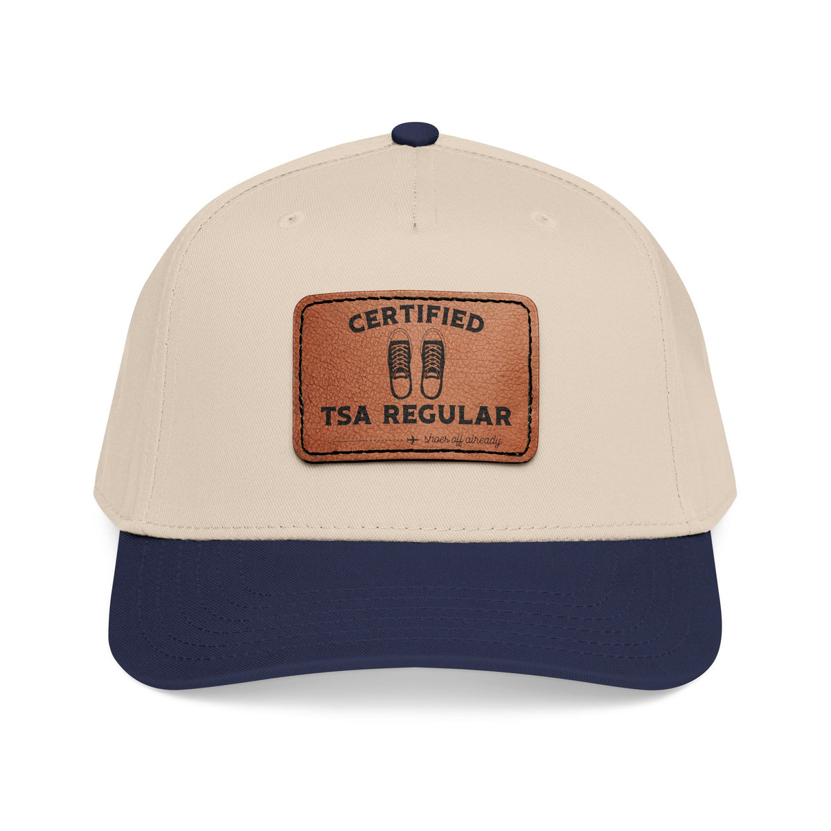 Beige and navy cap with a leather patch on a white background featuring 'Certified TSA Regular (shoes already off)'