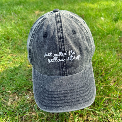 "Just pulled the yellow strap" Funny Travel Hat for Theme Park Lovers -  on grass